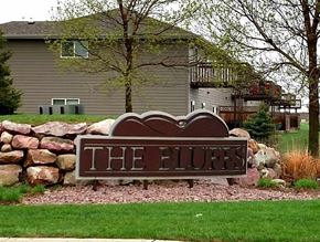 Brandon apartment for rent - A sign that says "The Bluffs" in front of a house.