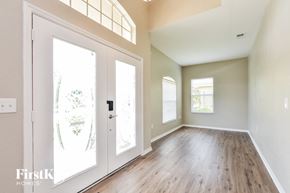 Winter Haven house for rent - A room with a white door and a window with blinds.