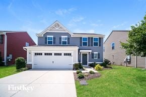 Nashville house for rent - A house with a red garage door is for sale.