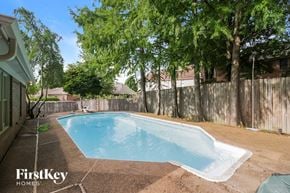 Cordova house for rent - A small pool surrounded by a fence and trees.