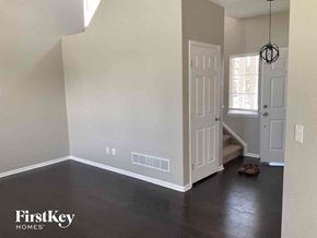 Aurora house for rent - an empty room with white walls and a white door