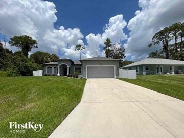 North Port house for rent - a house with a driveway in front of it