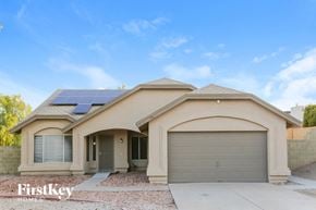 Glendale house for rent - a home with solar panels on the roof and a garage
