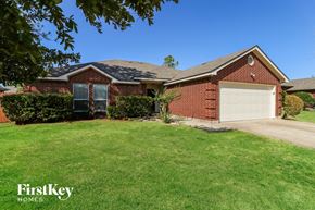 Saginaw house for rent - a home with a lawn and a garage
