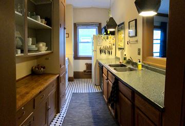 Minneapolis apartment for rent - A kitchen with wooden cabinets and a checkered floor.