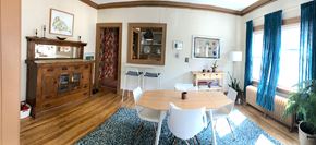 Minneapolis apartment for rent - A dining room with a wooden table and chairs.