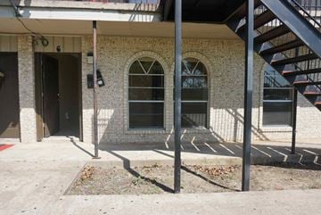 Bay City house for rent - the outside of a building with stairs and windows