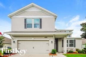 Green Cove Springs house for rent - a white house with a garage door in front of it