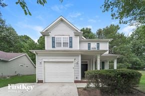 Charlotte house for rent - a white house with a white garage door