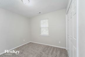 Charlotte house for rent - the bedroom of a home with carpet and a window