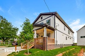 Atlanta house for rent - a white house with a porch and a tree