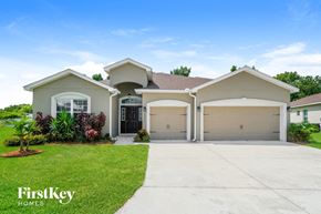 Lakeland house for rent - A house with a garage and a driveway is for sale.