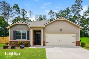 Covington house for rent - a beige house with a white garage door