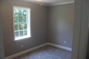 Purvis house for rent - a empty room with a window and carpet