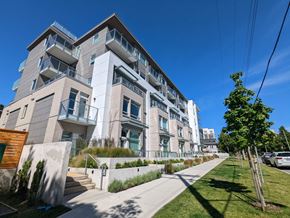 Victoria apartment for rent - A modern apartment building with a clear blue sky above.