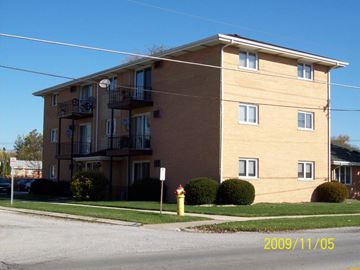 Lansing apartment for rent - A building with a fire hydrant in front of it.