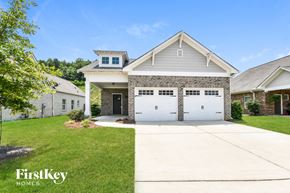 Gardendale house for rent - a house with a white garage door and a driveway