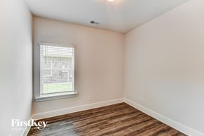 Gardendale house for rent - the living room of a home with a wood floor and a window