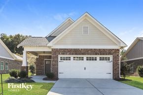 Gardendale house for rent - a white garage door in front of a brick house