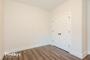 Gardendale house for rent - the living room of a home with a white door and wooden floors