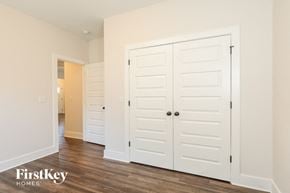 Gardendale house for rent - a bedroom with two closets and a door to a hallway
