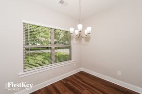 Irondale house for rent - a living room with a large window and a chandelier