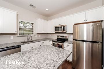 Irondale house for rent - a kitchen with granite counter tops and stainless steel appliances