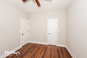 Irondale house for rent - the master bedroom has a hardwood floor and two closet doors