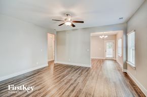 Irondale house for rent - a living room with wood floors and a ceiling fan