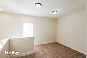 Birmingham house for rent - a bedroom with white walls and carpet and a window
