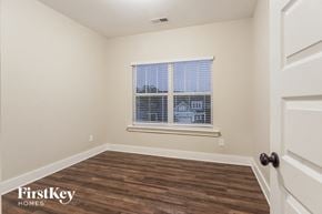 Birmingham house for rent - a bedroom with a window and wood floors