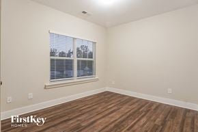 Birmingham house for rent - the living room of a home with wood flooring and a window
