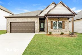 Cullman house for rent - a house with a driveway and a garage door
