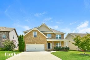 Clarksville house for rent - A house with a garage is shown in the image.