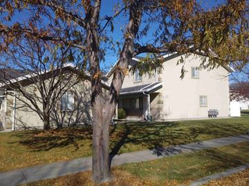 Logan apartment for rent - A house with a tree in front of it.