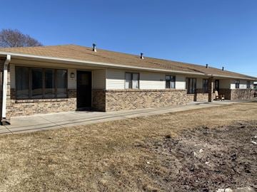 Kearney apartment for rent - a white house with a sidewalk in front of it