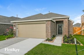 Hockley house for rent - A house with a garage door and a brick wall.