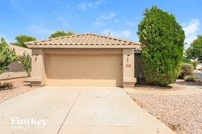 Mesa house for rent - a home with a garage door and a driveway