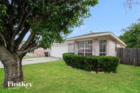 Fort Worth house for rent - A house with a tree in front of it.