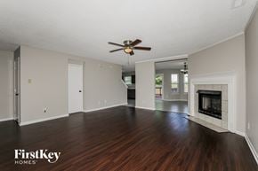 Brownsburg house for rent - A spacious room with a fireplace and wood flooring.