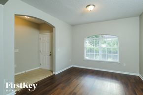 Jacksonville house for rent - the second bedroom with hardwood flooring and a window