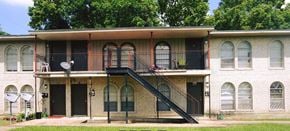 Bay City house for rent - A two-story building with a balcony on the second floor.