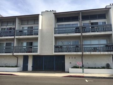 Hermosa Beach apartment for rent - A multi-story building with a balcony on each floor.