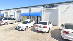 Largo apartment for rent - a car dealership with cars parked in front of it