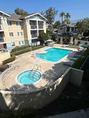 Claremont multi-family for rent - A swimming pool with a hot tub in the middle of it.