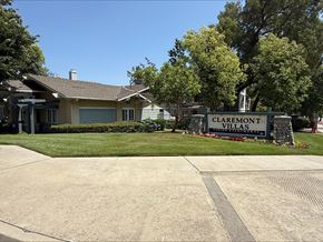 Claremont multi-family for rent - A sign that says Claremont Villas stands in front of a house.