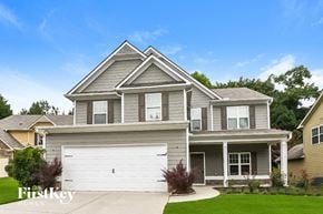 Canton house for rent - a gray house with a white garage door
