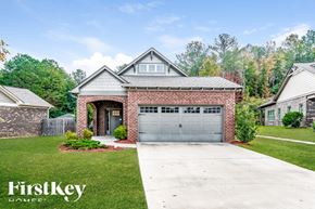 Gardendale house for rent - a brick house with a garage and a driveway