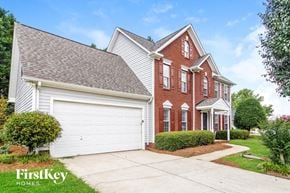 High Point house for rent - a brick and with a white garage door