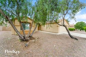 Tucson house for rent - a house with a tree in front of it